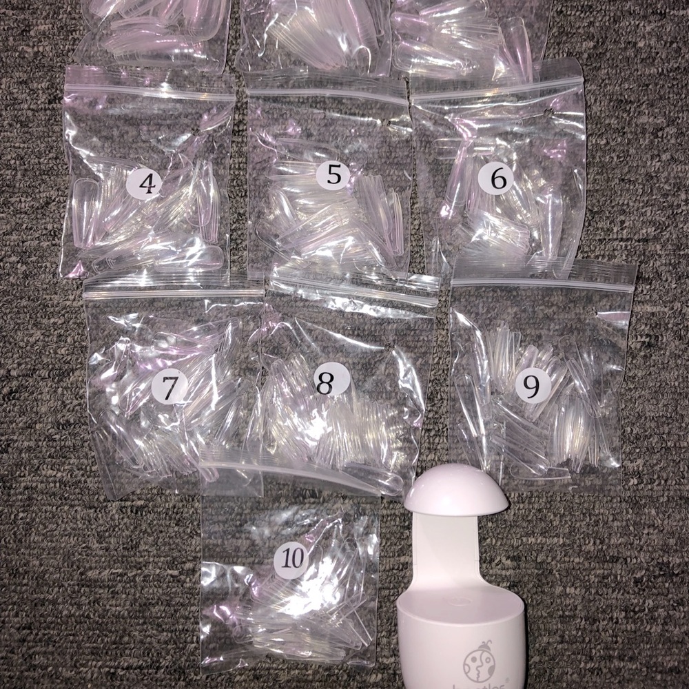 Beetles gel nail tips with mini uv light.